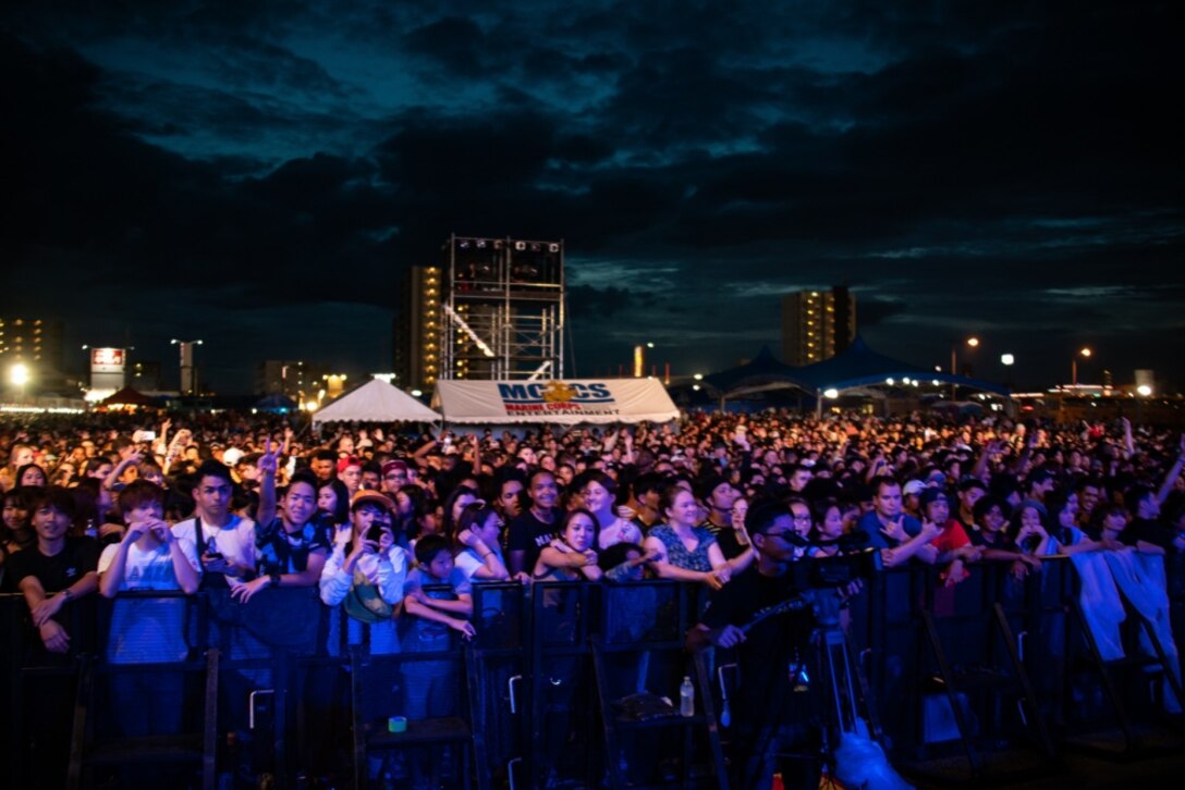 Members of the local and U.S. communities pose for a photo during The 2019 Camp Foster Festival, at Camp Foster, Okinawa, Japan, July 6-7, 2019.