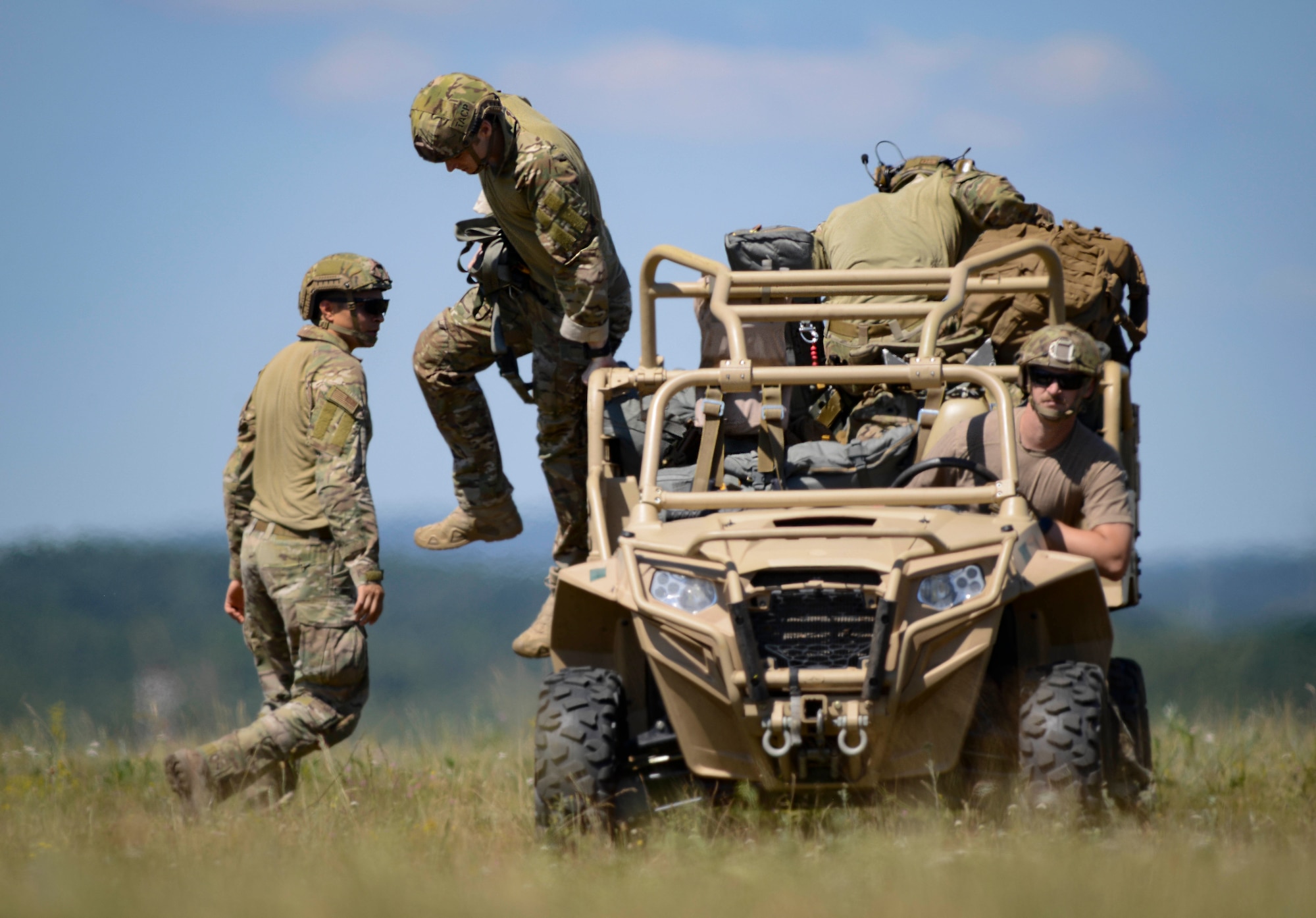 Parachutists offload at the meeting point after personnel drops over Ramstein Air Base, Germany, July 2, 2019. Such personnel drops are important for training in part because the 435th Contingency Response Group is U.S. Forces in Europe – Air Forces Africa’s force designed to airlift to a location and open a base there from scratch.