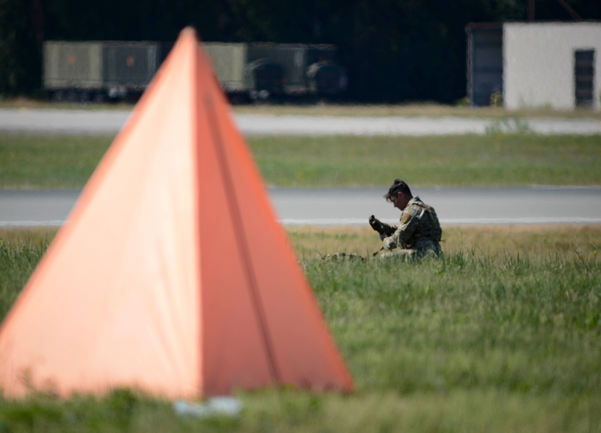 U.S. Staff Sgt. Mark Melchiori, 435th Security Forces Squadron jump master, gathers his parachute and gear during personnel drops over Ramstein Air Base, Germany, July 2, 2019. The 86th Operations Support Squadron and the 37th Airlift Squadron coordinated to accomplish the drop over Ramstein’s airfield despite airlift operations.