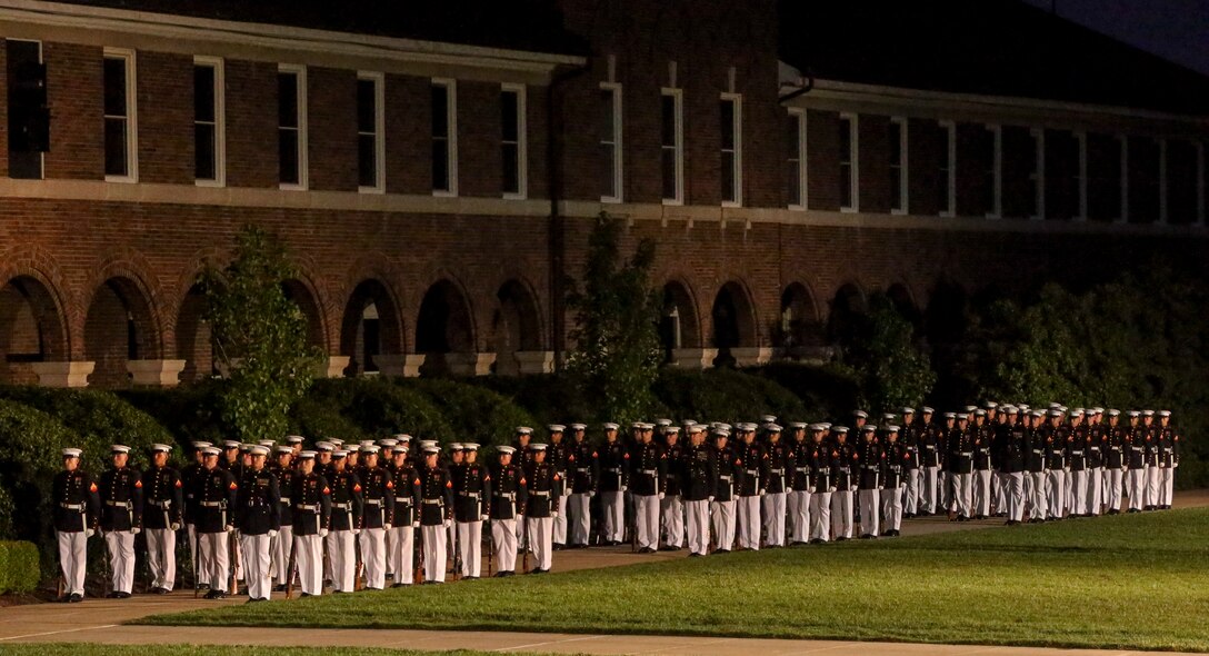 Marines with Bravo Company march onto the parade deck during a Friday Evening Parade at Marine Barracks Washington, D.C., July 5, 2019. General Robert B. Neller, commandant of the Marine Corps, was the hosting official and the guest of honor was The Honorable Mr. Michael R. Pompeo, U.S. Secretary of State. (U.S. Marine Corps photo by Sgt. Robert Knapp)