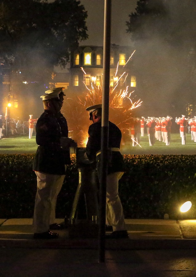 Body Bearers with Bravo Company fire cannons during a Friday Evening Parade at Marine Barracks Washington, D.C., July 5, 2019. General Robert B. Neller, commandant of the Marine Corps, was the hosting official and the guest of honor was The Honorable Mr. Michael R. Pompeo, U.S. Secretary of State. (U.S. Marine Corps photo by Pfc. Allen Sanders)