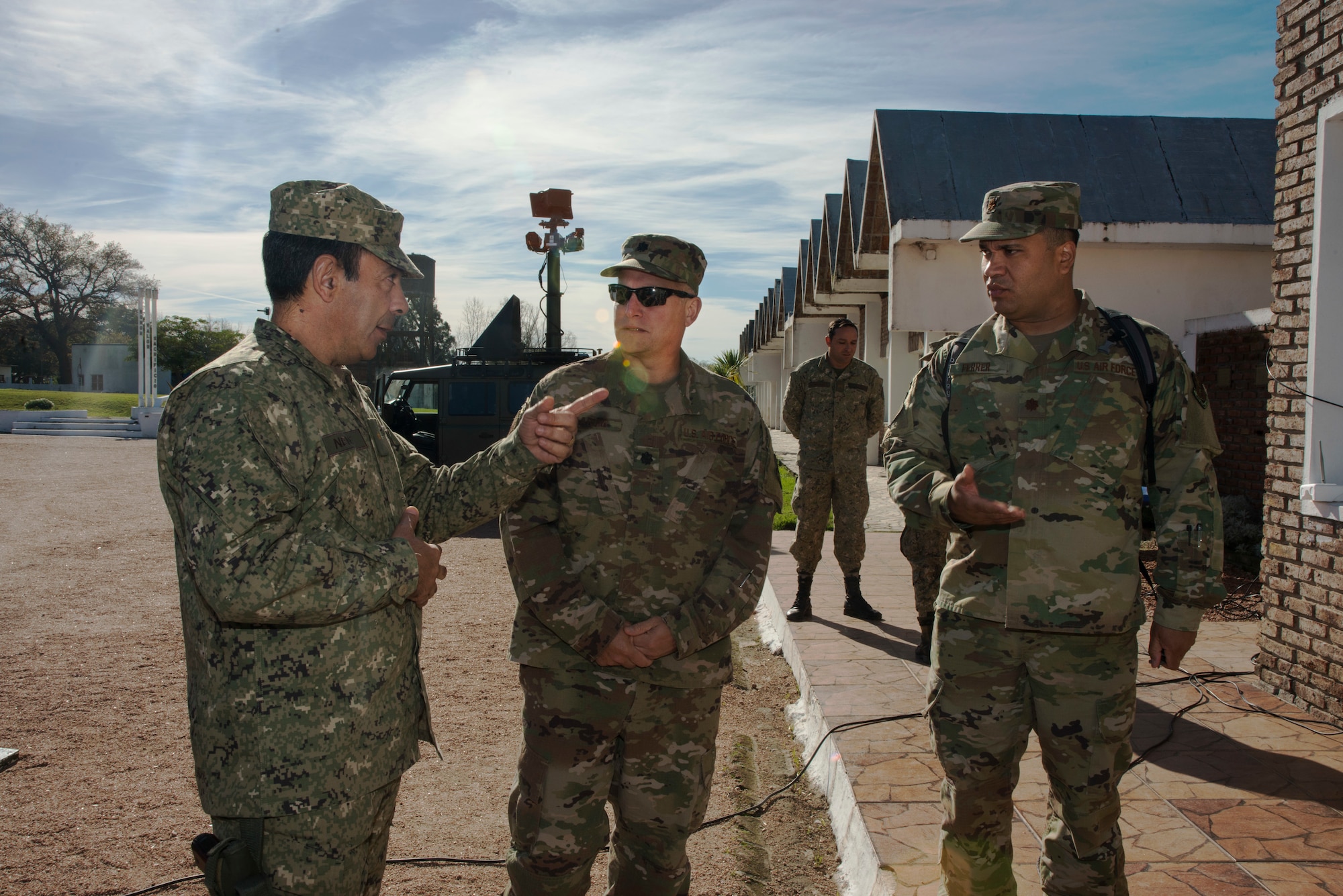 Uruguayan Army Colonel Dyver M. Neme, Communications Brigade One Commander (left), discusses the Uruguayan Army's communications capabilities with Lt. Col. Guy Marino, 103rd Air Control Squadron (center) and Maj. David Ferrer, Connecticut State Partnership Program Director (right) in Montevideo, Uruguay, June 27, 2019. One of the main purposes of this State Partnership Program visit for the Connecticut National Guard to assess Uruguay's joint military operability. (U.S. Air National Guard photo by Capt. Jen Pierce)