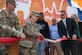 U.S. Army Col. Jennifer S. Walkawicz, 733rd Mission Support Group commander, cuts a ribbon during the grand opening of the Dentrust Optimized Care Solutions mobile treatment facility at Joint Base Langley-Eustis, Virginia, July 8, 2019.