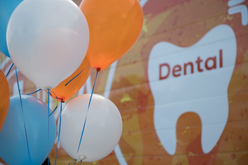 Balloons are set up to celebrate the grand opening of the Dentrust Optimized Care Solutions mobile treatment facility at Joint Base Langley-Eustis, Virginia, July 8, 2019.