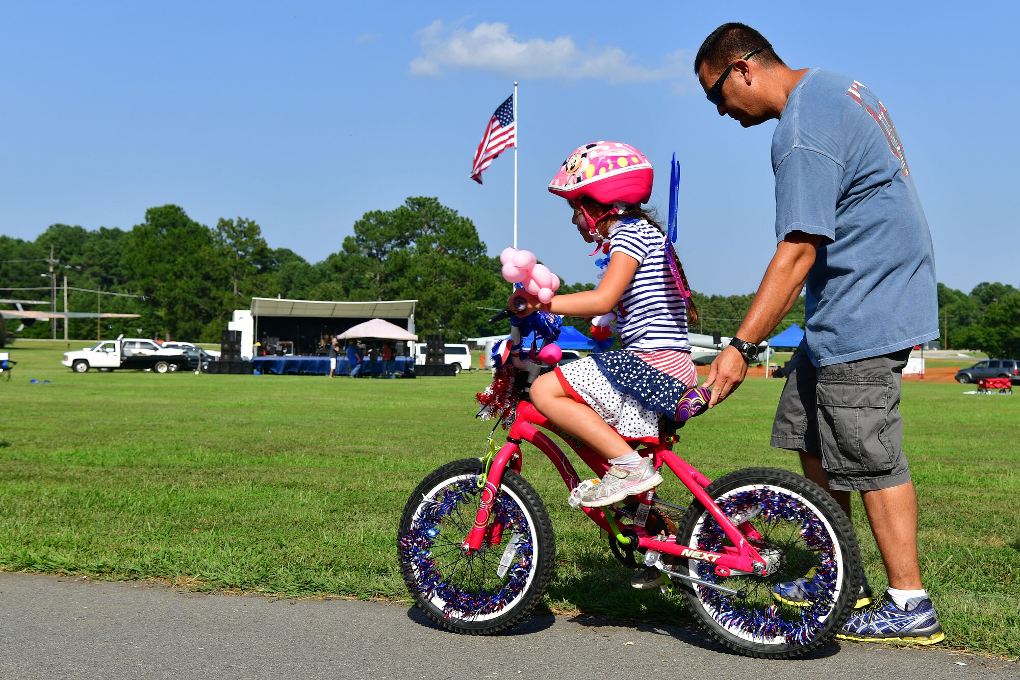 A child rides a bike at the Liberty Fest.