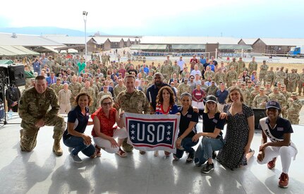 Left to right: Army Command Sgt. Maj. Christopher Kepner, senior enlisted advisor to the chief of the National Guard Bureau; Toni Trucks; Sally Lengyel; Air Force Gen. Joseph Lengyel, chief, National Guard Bureau; Quinton “Rampage” Jackson; Laura Bryna; Anjelah Johnson; Cassadee Pope; Mayim Bialik; and Nia Franklin pose for a photo after a USO performance, Camp Bondsteel, Kosovo, July 4, 2019. Gen. Lengyel is hosting a USO Tour, visiting troops in six countries in three combatant commands.