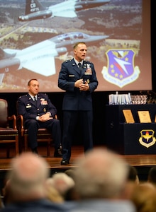 Retired Brig. Gen. John Cherrey, former Director of Intelligence, Operations and Nuclear Integration, Headquarters Air Education and Training Command at Joint Base San Antonio-Randolph, speaks to attendees during Specialized Undergraduate Pilot Training Class’s 19-17/18 graduation in the Kaye Auditorium June 28 at Columbus Air Force Base, Mississippi. Cherrey spoke about his last 30 years as a pilot and wanted the newest generation of aviators to understand how important their job is.