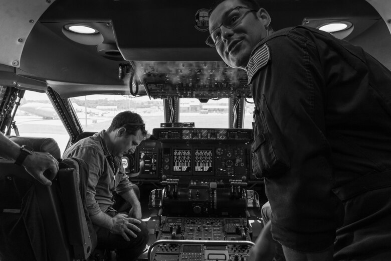 Director Oliver Butler with the Arts in the Armed Forces, looks over the controls in the cockpit of a C-5M Super Galaxy during a tour of the 433rd Airlift Wing, Joint Base San Antonio-Lackland, Texas, June 28, 2019.