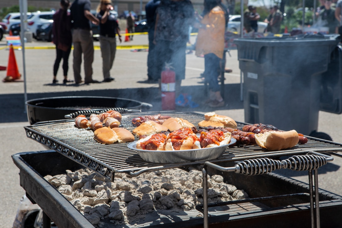 Lunch was prepared and laid out for Marines and family during the Headquarters and Headquarters Squadron (H&HS) Barbecue Cook-off at Marine Corps Air Station Miramar, Calif., Jul. 3. The H&HS Barbecue Cook-off was held this month in order to build unit cohesion and boost morale throughout the squadron. (U.S. Marine Corps photo by LCpl. Andrew Hiatt