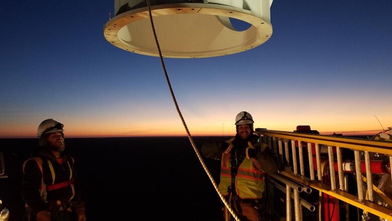 Contractors with Telecommunication Support Services Solutions, Inc., based in Florida, install a radome on a Weather Surveillance Doppler radar overnight Feb. 17 at Cannon Air Force Base, New Mexico. The company is on contract as part Program Executive Office Digital’s effort to support and sustain 25 radars owned by the U.S. Air Force. These 25 radars are one portion of more than 180 U.S. government-owned radars, called the NEXRAD system, which provides weather forecasts to the military, Federal Aviation Administration and National Weather Service. (Photo courtesy of Telecommunication Support Services Solutions)