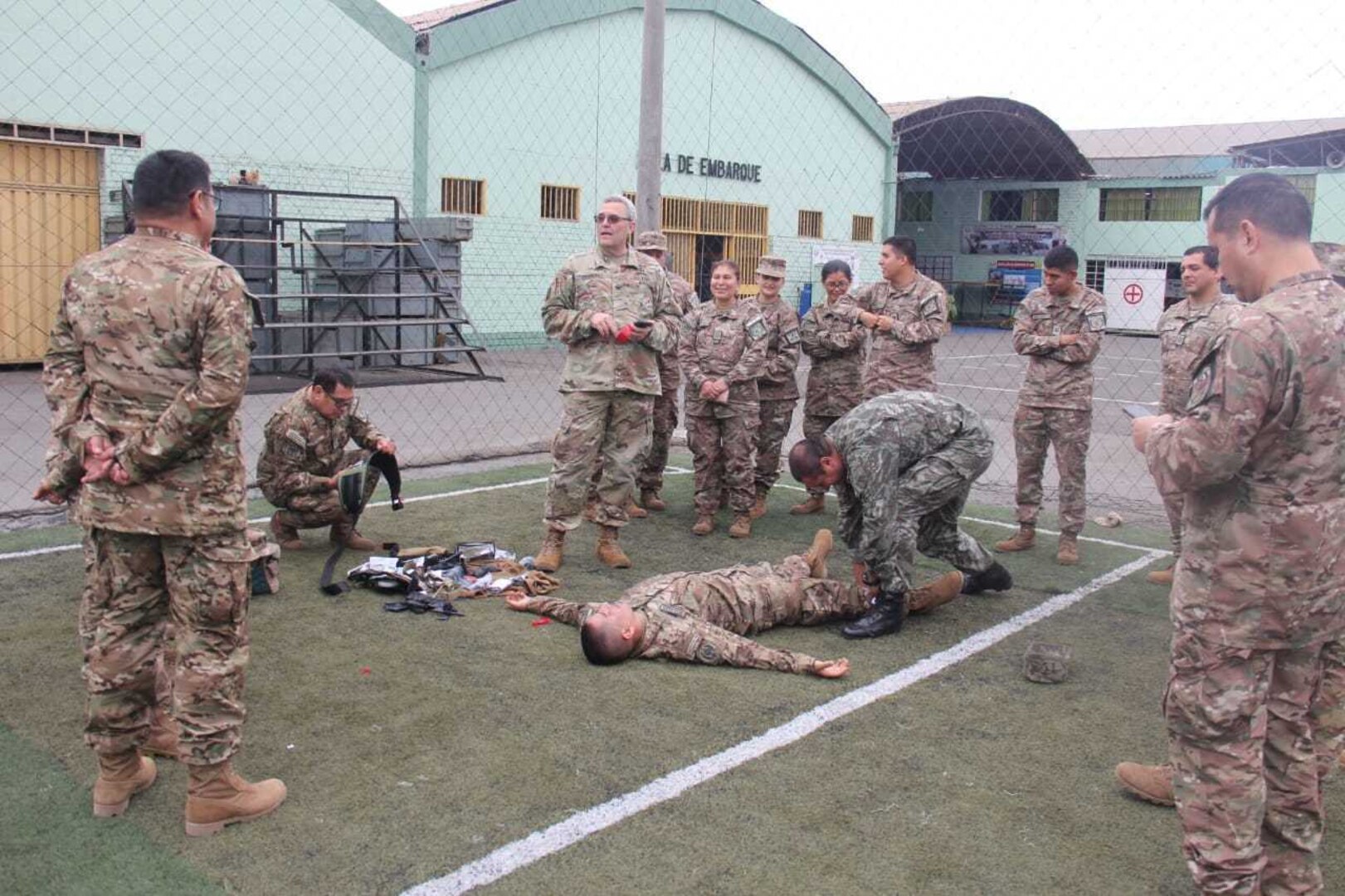 U.S. Army Col. Todd Fredricks, West Virginia Army National Guard (WVARNG) state surgeon, speaks with members of the Peruvian Armed Forces during a hands-on training sessions tactical casualty combat care (TCCC) July 2, 2019, in Lima, Peru. Members of the WVARNG trained more than 120 members of the Peruvian Armed Forces and the Peruvian National Police on a variety of aeromedical topics during a week-long subject matter exchange. (Courtesy photo)
