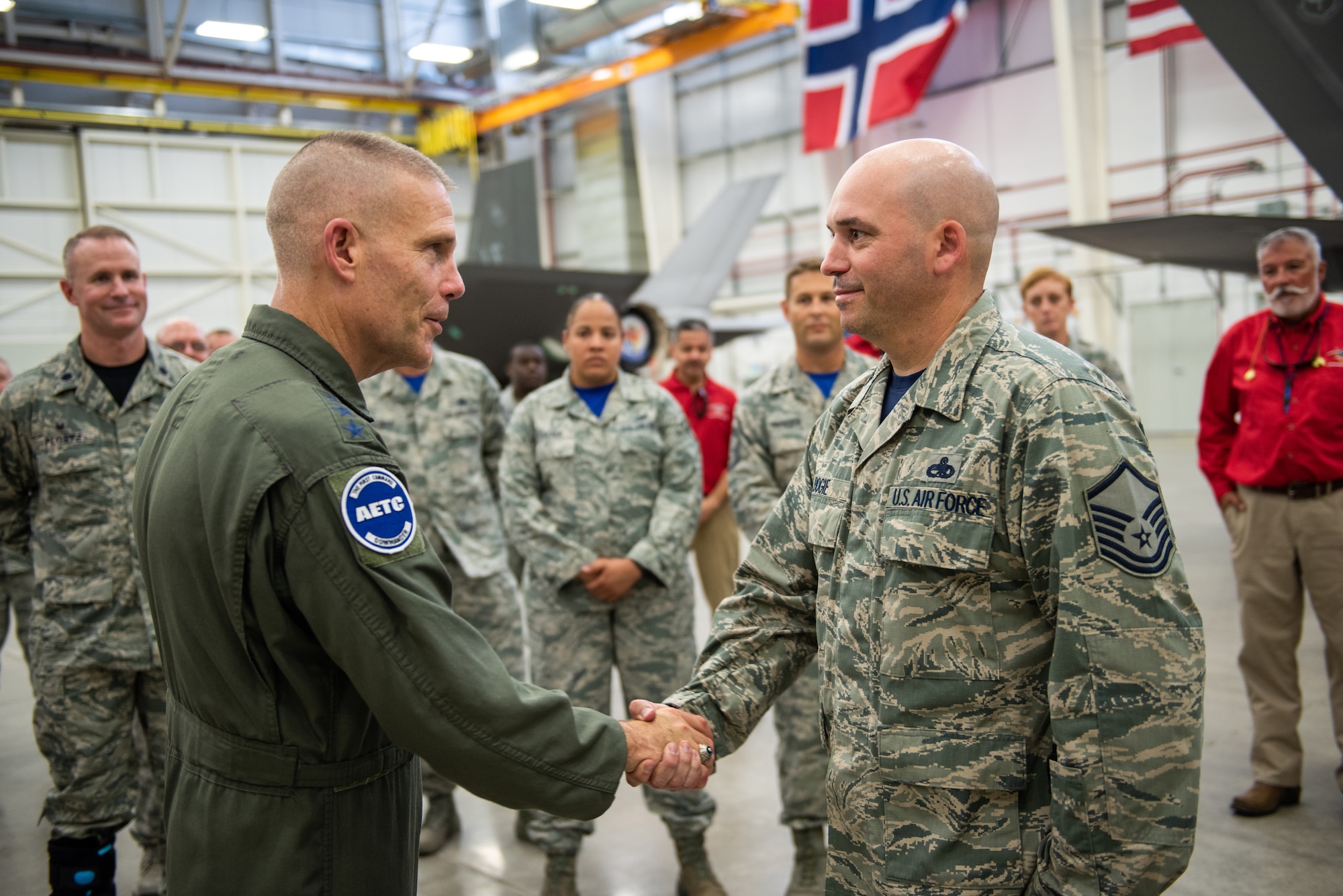 U.S. Air Force Lt. Gen. Steven Kwast, commander of Air Education and Training Command, meets with an Airman assigned to the 56th Fighter Wing at Luke Air Force Base, Arizona during a visit July 20, 2018.  Kwast, a U.S. Air Force Academy graduate, will pass command of AETC to Lt. Gen. Brad Webb July 26, 2019. (U.S. Air Force photo / Courtesy)