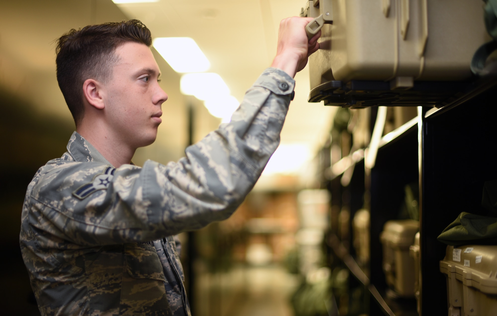 U.S. Air Force Airman 1st Class Caleb Kavanaugh, 60th Operations Support Squadron Aircrew Flight Equipment technician, inspects aircrew equipment July 9, 2019, at Travis Air Force Base, California. Travis’ AFE flight works to keep aircrew flight equipment in good working condition thereby safeguarding aircrew personnel in the event of dangerous situations. (U.S. Air Force photo by Senior Airman Christian Conrad)