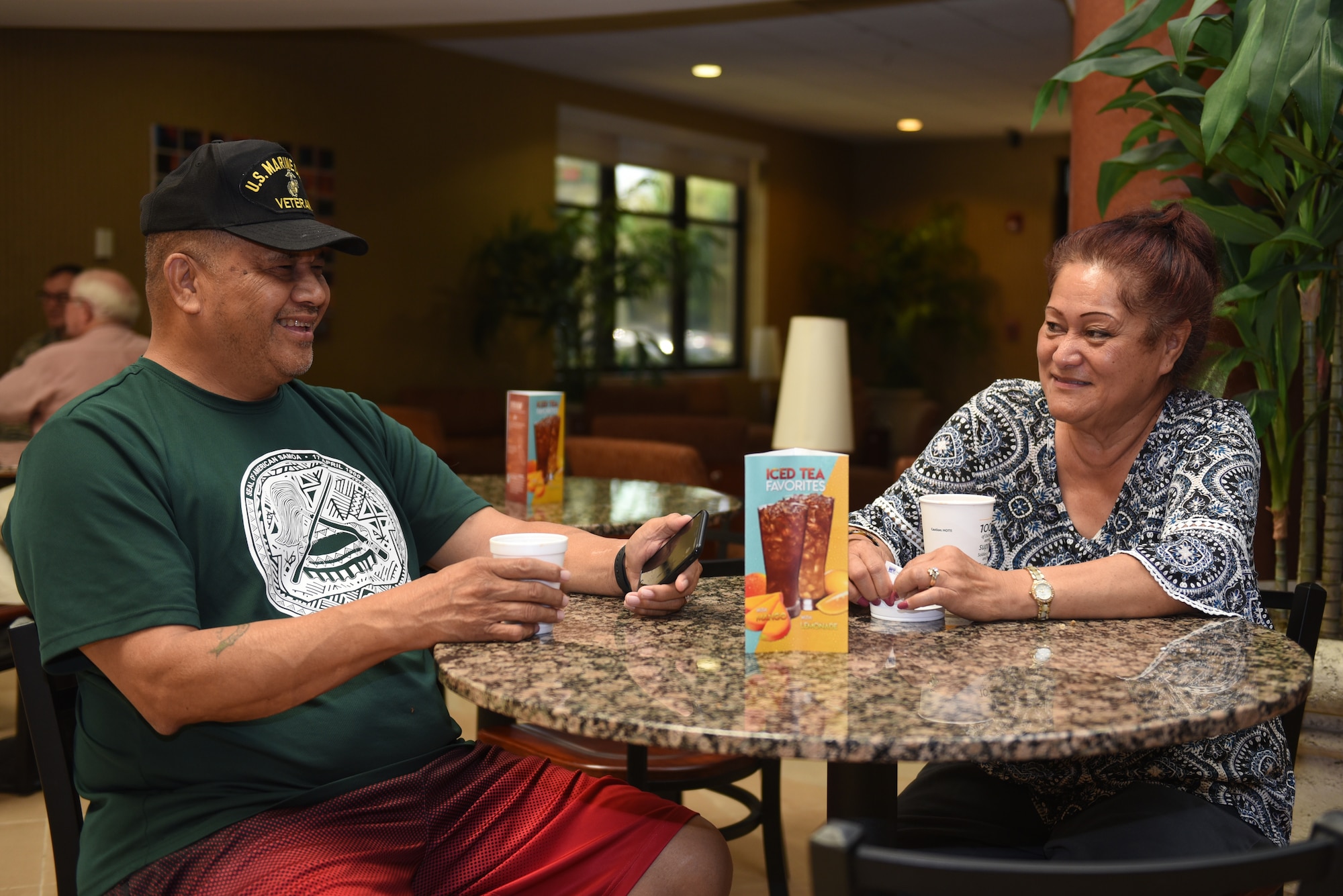 Meri and Aloha Nua, Westwind Inn guests, relax in the Westwind Inn café July 8, 2019, at Travis Air Force Base, California. Westwind Inn is one of the finalists for the Air Force’s 2019 Innkeeper Award after being named the best in Air Mobility Command. The Innkeeper Award is an annual honor recognizing excellence in the service’s lodging operations. (U.S. Air Force photo by Airman 1st Class Cameron Otte)