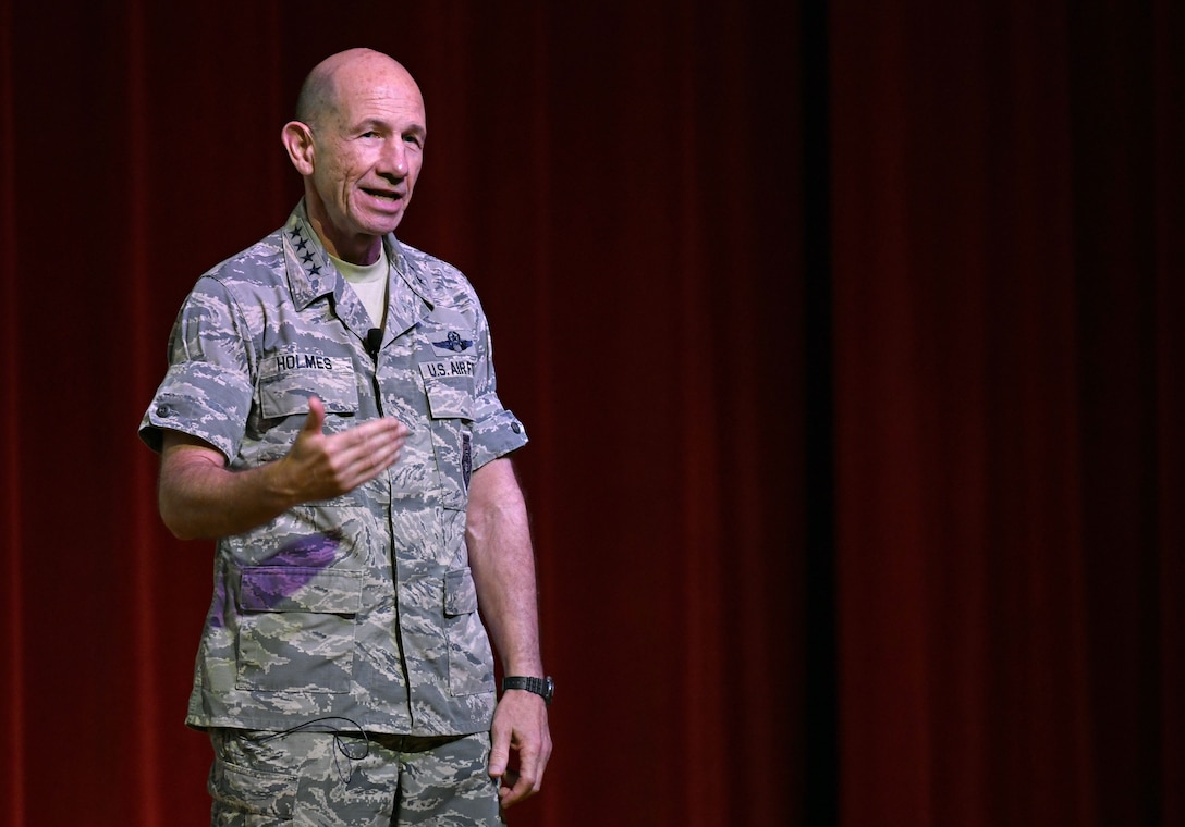 Photo of Gen. Mike Holmes, commander of Air Combat Command, discussing future 24th/25th Air Force merger at a town hall meeting.