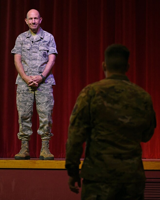 Photo of Gen. Mike Holmes, commander of Air Combat Command, discussing future 24th/25th Air Force merger at a town hall meeting.