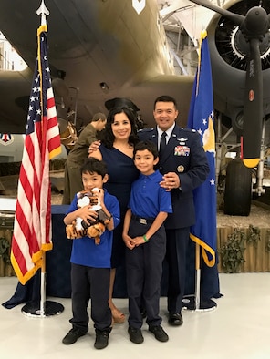 Lt. Col. Carlos Jayme, the newly appointed 436th Communications Squadron commander, poses with his family following a change of command ceremony July 7, 2017. (Courtesy photo by Lt. Col. Carlos Jayme)