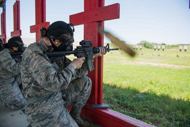 U.S. Air Force basic military training trainees fire their M-4 Carbine during a weapons familiarization course, June 8, 2019, at Joint Base San Antonio-Medina Annex. BMT trainees were the first to experience M-4 Carbine Weapons Familiarization Course at the new facility, which closed in November 2018, due to improper rainwater drainage. The firing range allows instructors to train 244 BMT trainees daily, four days a week, qualifying more than 40,000 BMT trainees in the M-4 carbine annually. (U.S. Air Force photo by Sarayuth Pinthong)