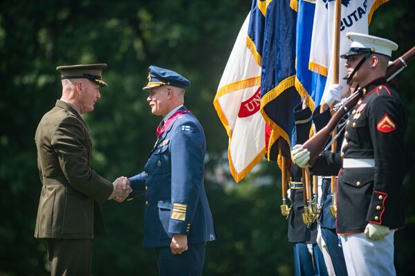 Marine Corps Gen. Joe Dunford, chairman of the Joint Chiefs of Staff, hosts an Armed Forces Full Honor Arrival Ceremony for Finnish Air Force Gen. Jarmo Lindberg, Finnish Chief of Defense, on Whipple Field at Joint Base Myer-Henderson Hall, July 9, 2019.