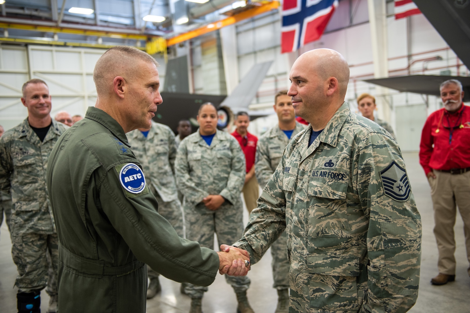 U.S. Air Force Lt. Gen. Steven Kwast, commander of Air Education and Training Command, meets with an Airman assigned to the 56th Fighter Wing at Luke Air Force Base, Arizona during a visit July 20, 2018.  Kwast, a U.S. Air Force Academy graduate, will pass command of AETC to Lt. Gen. Brad Webb July 26, 2019. (U.S. Air Force photo / Courtesy)