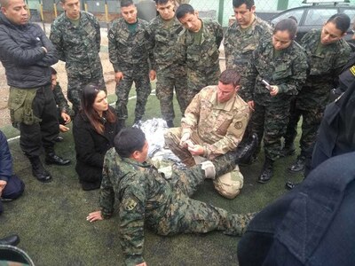 Sgt. Brad Miller, a medical readiness non-commissioned officer with the West Virginia Army National Guard (WVARNG) medical detachment, provides training on tactical casualty combat care (TCCC) to members of the Peruvian Armed Forces during a hands-on training held July 2, 2019, in Lima, Peru.