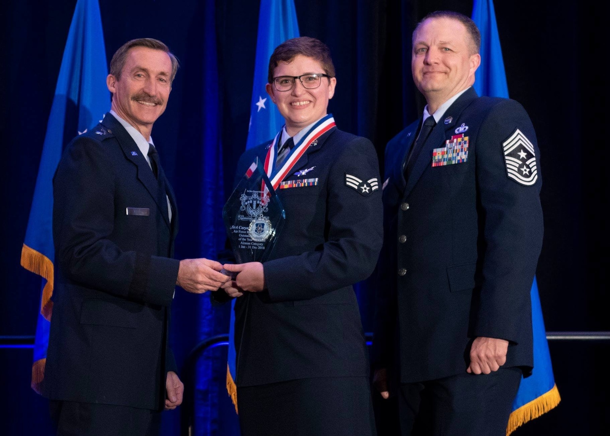 Then Senior Airman Caryn Frederick, 19th Space Operations Squadron technician, is recognized as the 2018 12 Outstanding Airman of the Year Award, Airman category for the Air Force Reserve Command in St. Augustine, Florida, March 27, 2019. Frederick said her team at Schriever Air Force Base helped push her to win this award. (U.S. Air Force courtesy photo)