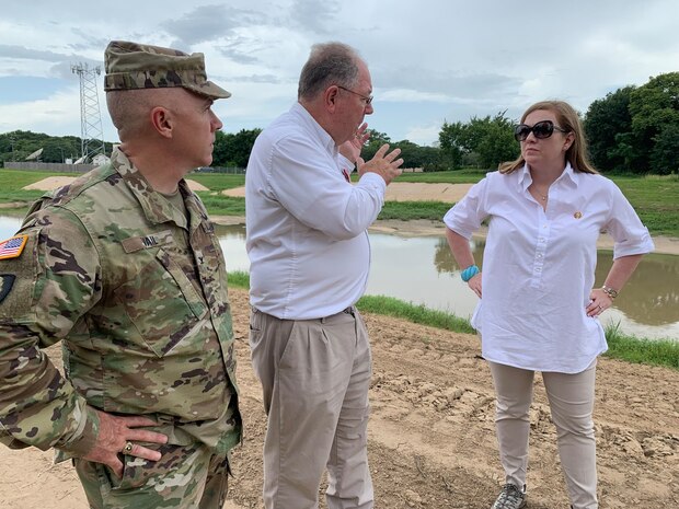 HOUSTON (July 3, 2019) Richard Long, a natural resources manager with the U.S. Army Corps of Engineers Galveston District, discusses the Fort Bend Drainage District to desilt Buffalo Bayou with 7th District U.S. Representative Lizzie Fletcher during a tour the Addicks and Barker reservoirs and dams with Col. Timothy Vail, Galveston District commander.