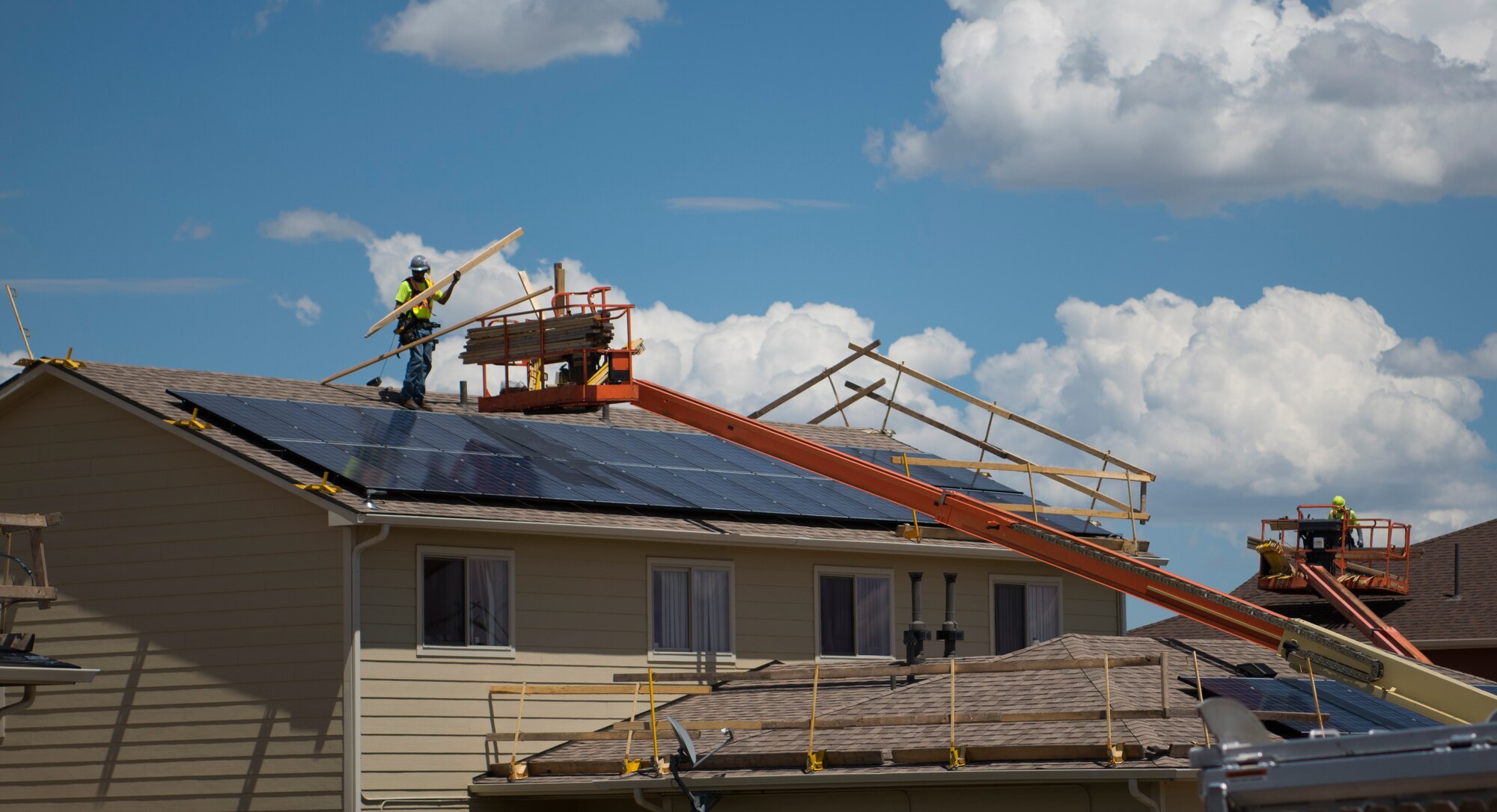 Construction workers replace the shingles on roofs at the Tierra Vista Communities at Schriever Air Force Base, Colorado, July 8, 2019. TVC’s mission is to provide outstanding communities where military families live, work and thrive. (U.S. Air Force photo by Airman 1st Class Jonathan Whitely)