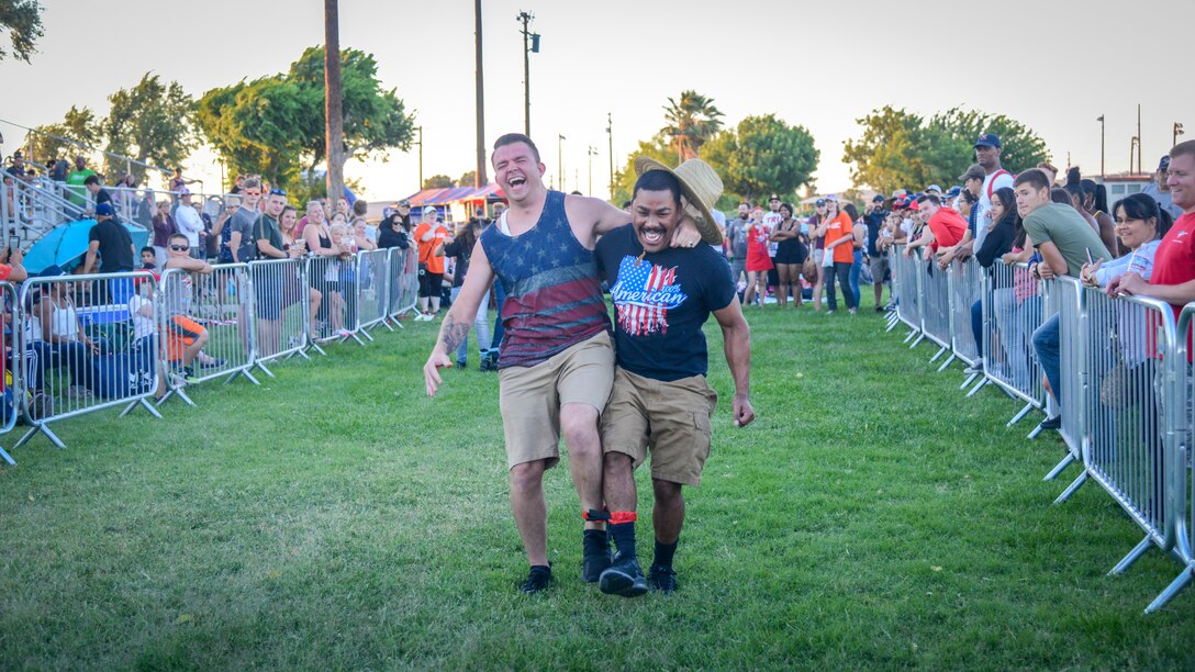 Team Edwards members participate in a game during Summer Bash 2019, an Independence Day celebration, at Edwards Air Force Base, California. The event featured rides, games, live music and fireworks. (U.S. Air Force photo by Giancarlo Casem)