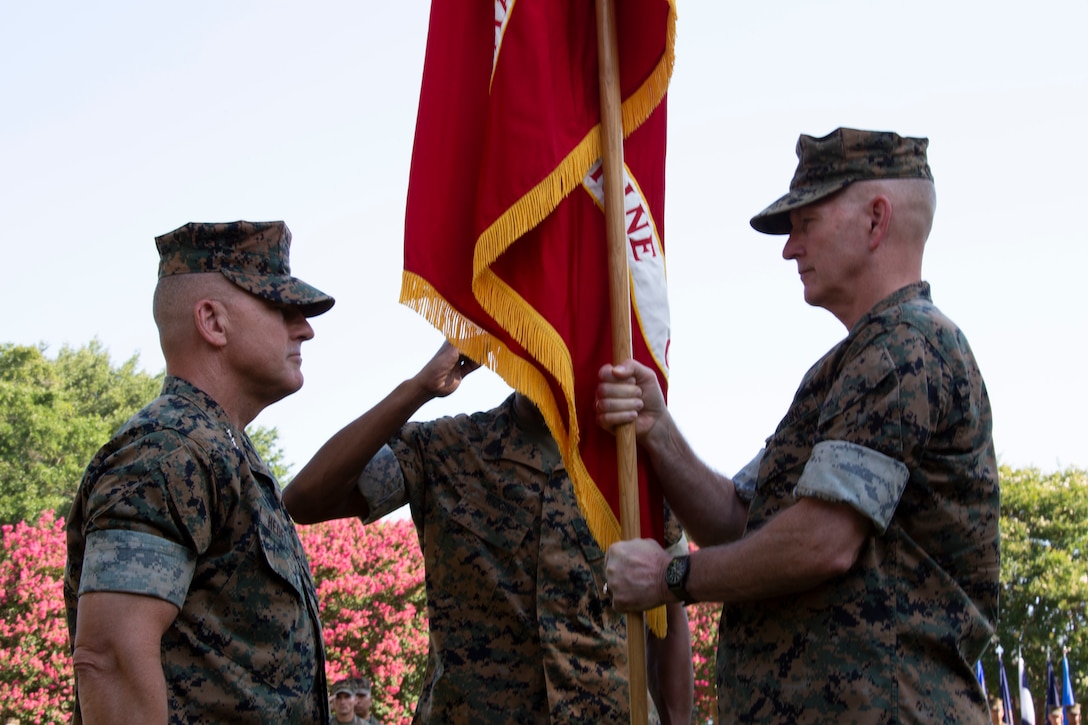 Outgoing commander of U.S. Marine Corps Forces Command (MARFORCOM) Lt. Gen. Mark A. Brilakis, right, relinquishes command to Lt. Gen. Robert F. Hedelund, the incoming MARFORCOM commanding general during the MARFORCOM change of command ceremony at Naval Support Activity Hampton Roads, Virginia, July 3, 2019. The change of command is a time-honored tradition where all responsibilities and authority are ceremoniously passed from one commander to another. MARFORCOM is one of three major Marine Corps commands, along with U.S. Marine Corps Forces, Pacific and U.S. Marine Corps Forces, Reserve, which generates operating forces to support Unified or Joint Task Force Commanders. (U.S. Marine Corps photo by Sgt. Jessika Braden/ Released)