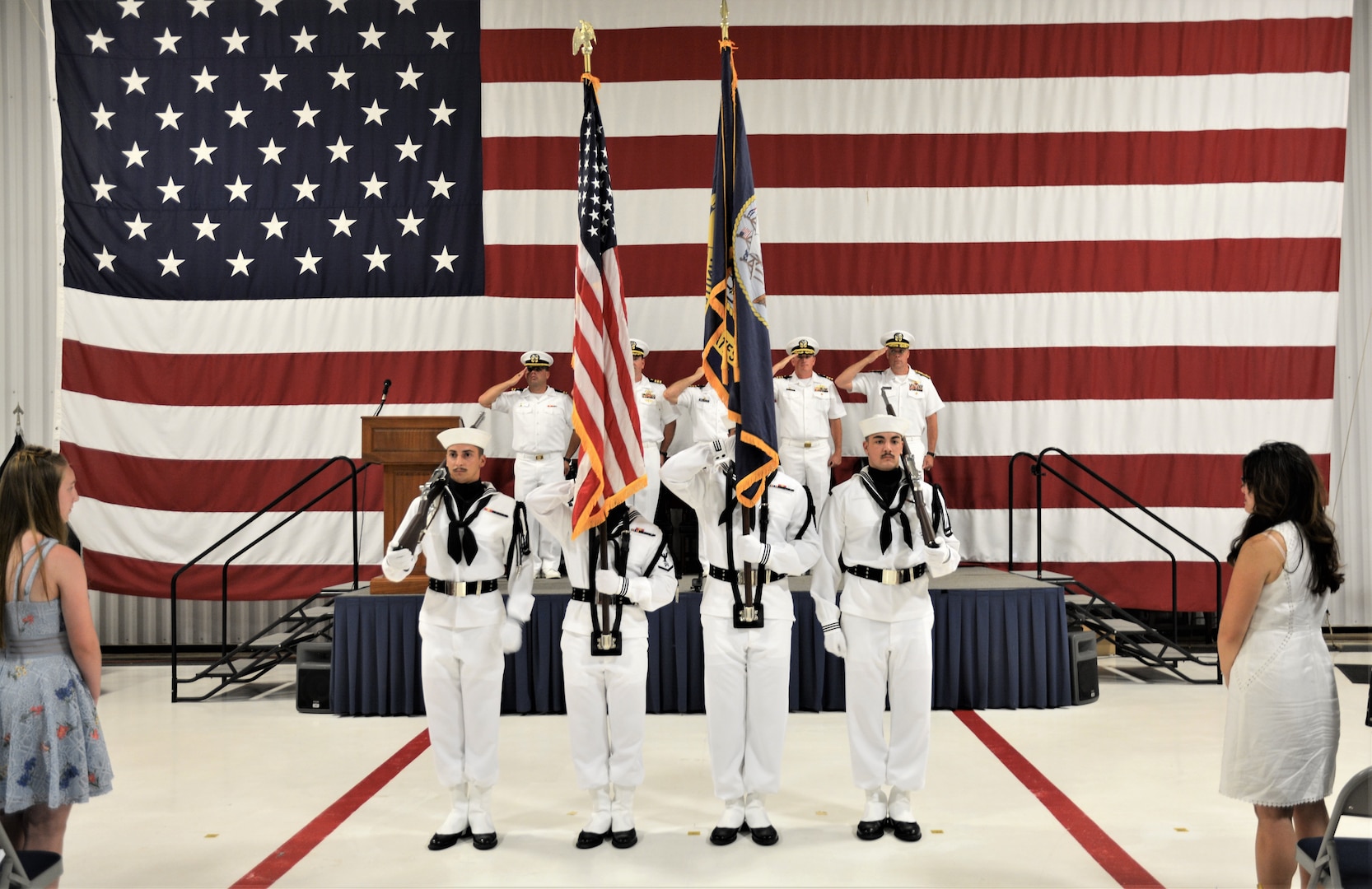 IMAGE: Ceremonial Color Guard members prepare to present colors prior to the national anthem. More than 200 Sailors and guests attended a traditional change of command ceremony at Naval Air Station (NAS) Oceana’s Center for Naval Aviation Technical Training Unit’s ceremonial hangar aboard NAS Oceana June 27 where Cmdr. Andrew Hoffman was relieved of command by Cmdr. Joseph Oravec. Oravec became the 28th commanding officer, Naval Surface Warfare Center Dahlgren Division, Dam Neck Activity.
