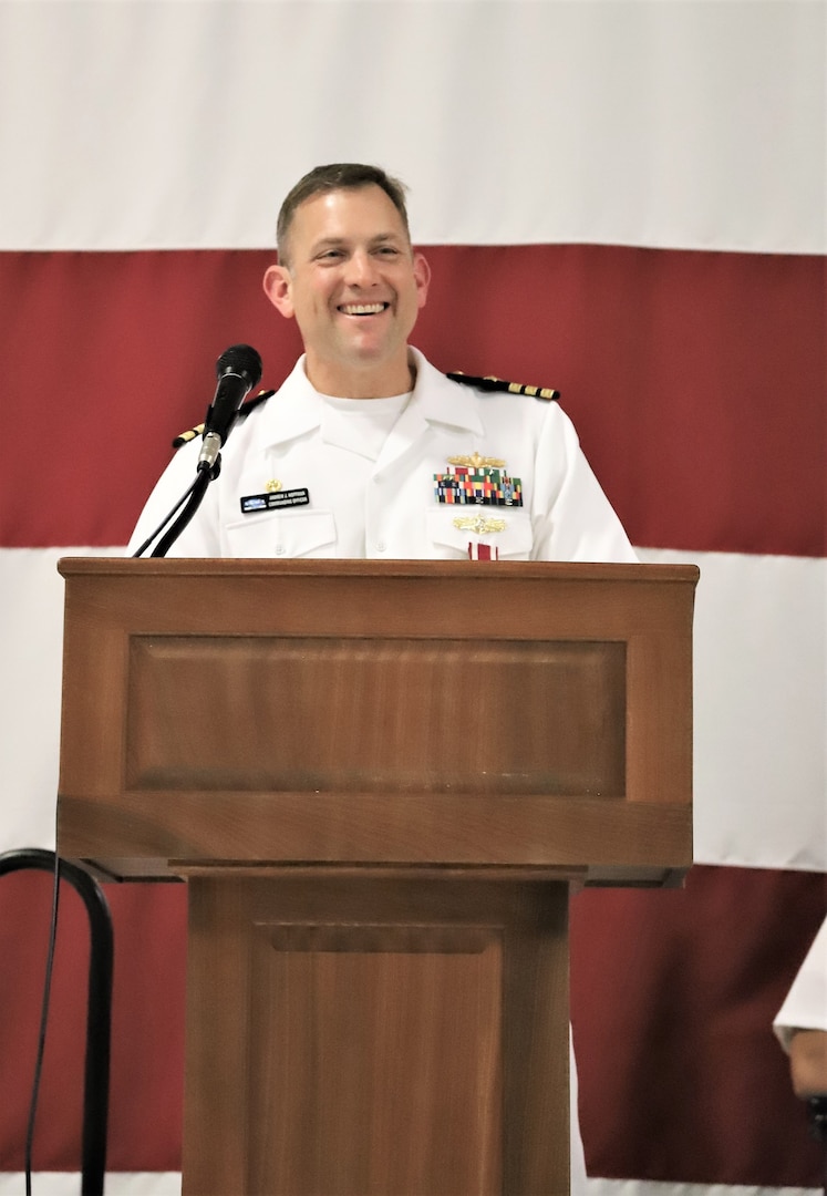 IMAGE: Cmdr. Andrew Hoffman gives his farewell address on his three plus years as Naval Surface Warfare Center Dahlgren Division, Dam Neck Activity’s commanding officer. More than 200 Sailors and guests attended a traditional Change of Command ceremony at Naval Air Station (NAS) Oceana’s Center for Naval Aviation Technical Training Unit’s ceremonial hangar aboard NAS Oceana June 27 where Hoffman was relieved of command by Cmdr. Joseph Oravec. Oravec became the command’s 28th commanding officer.