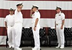 IMAGE: (Left to right) Cmdr. Joseph Oravec renders as salute to Cmdr. Andrew Hoffman while Cmdr. Casey Plew, Commanding Officer, Naval Surface Warfare Center Dahlgren Division, presides over Naval Surface Warfare Center Dahlgren Division, Dam Neck Activity’s change of command. More than 200 Sailors and guests attended a traditional Change of Command ceremony at Naval Air Station (NAS) Oceana’s Center for Naval Aviation Technical Training Unit’s ceremonial hangar aboard NAS Oceana June 27 where Hoffman was relieved of command by Oravec. Oravec became the command’s 28th commanding officer.