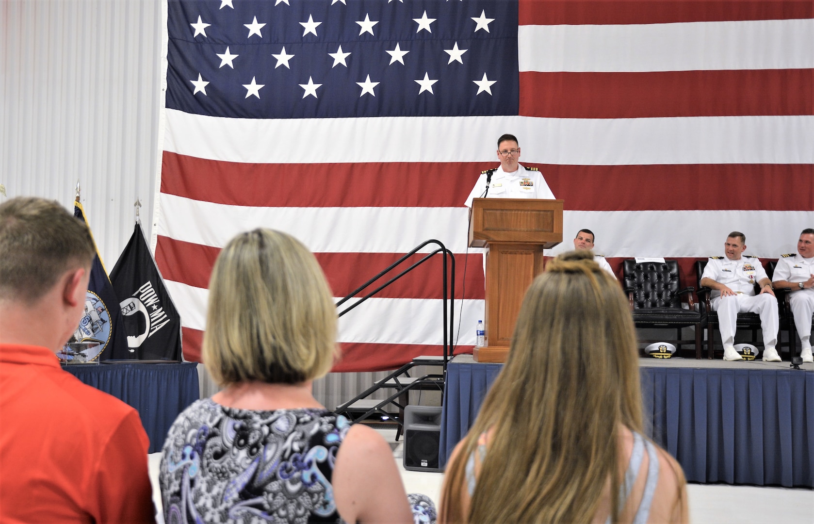 IMAGE: (Center) Cmdr. Joseph Oravec addresses more than 200 Sailors and guests after accepting command of Naval Surface Warfare Center Dahlgren Division, Dam Neck Activity from CDR Andrew Hoffman. The two naval officers held their traditional Change of Command ceremony at Naval Air Station (NAS) Oceana’s Center for Naval Aviation Technical Training Unit’s ceremonial hangar aboard NAS Oceana June 27. Oravec is the command’s 28th commanding officer.