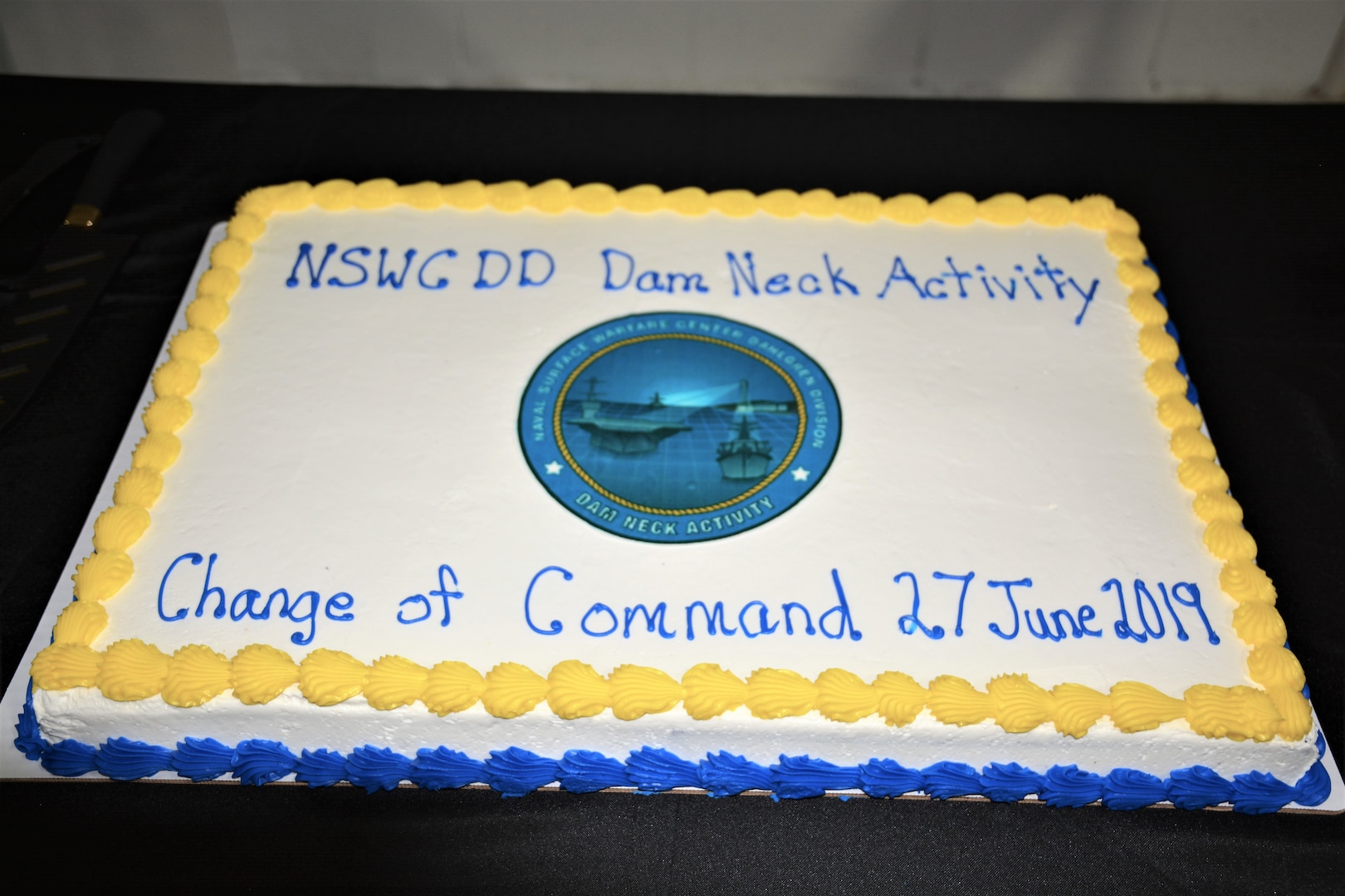 IMAGE: Cake and refreshments were available to guests following Naval Surface Warfare Center Dahlgren Division, Dam Neck Activity’s Change of Command ceremony June 27. More than 200 Sailors and guests attended a traditional ceremony at Naval Air Station Oceana’s Center for Naval Aviation Technical Training Unit’s ceremonial hangar aboard NAS Oceana where Cmdr. Andrew Hoffman was relieved of command by Cmdr. Joseph Oravec, who became the command’s 28th commanding officer.