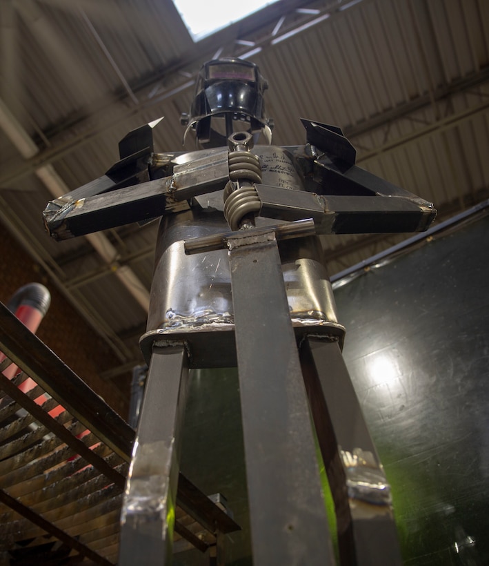 An iron statue welded by service members stands in the welding section in The Garden by Building Momentum, Alexandria, Va. The Garden hosts a wide variety of problem solving classes using science, engineering, and technology.