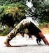 Female bent over in exercise class.