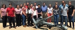 IMAGE: DAHLGREN, Va. (July 2, 2019) - Students from Virginia and Maryland high schools participating in the Science and Engineering Apprenticeship Program at Naval Surface Warfare Center (NSWC) Dahlgren Division and NSWC Indian Head Explosive Ordnance Disposal Technology Division pause - with an engineer from both commands - in front of the Potomac River Test Range metal map during their tour.