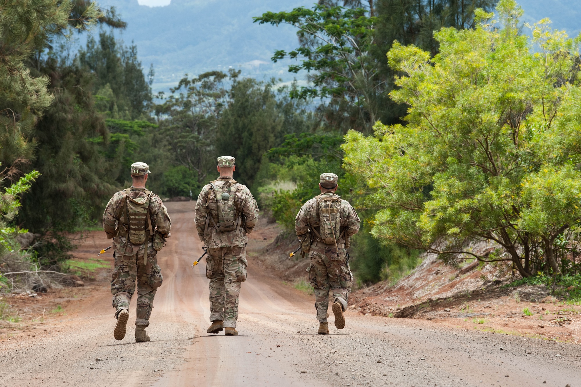 1st Lt. Austin Hoover, Tech. Sgt. Alexander Morley, and Staff Sgt. Jose Obregon, Ranger Assessment Course students, conduct land navigation during as one of their first tasks during the Ranger Assessment Course near Schofield Barracks, Oahu, Hawaii, May 13, 2019. The purpose of the 19-day course is to prepare, assess and evaluate Air Force candidates for Army Ranger School. The Airmen who pass the RAC gain more than a ticket into Ranger School and knowledge on Army tactics – they learn to lead. (U.S. Air Force photo by Staff Sgt. Hailey Haux)