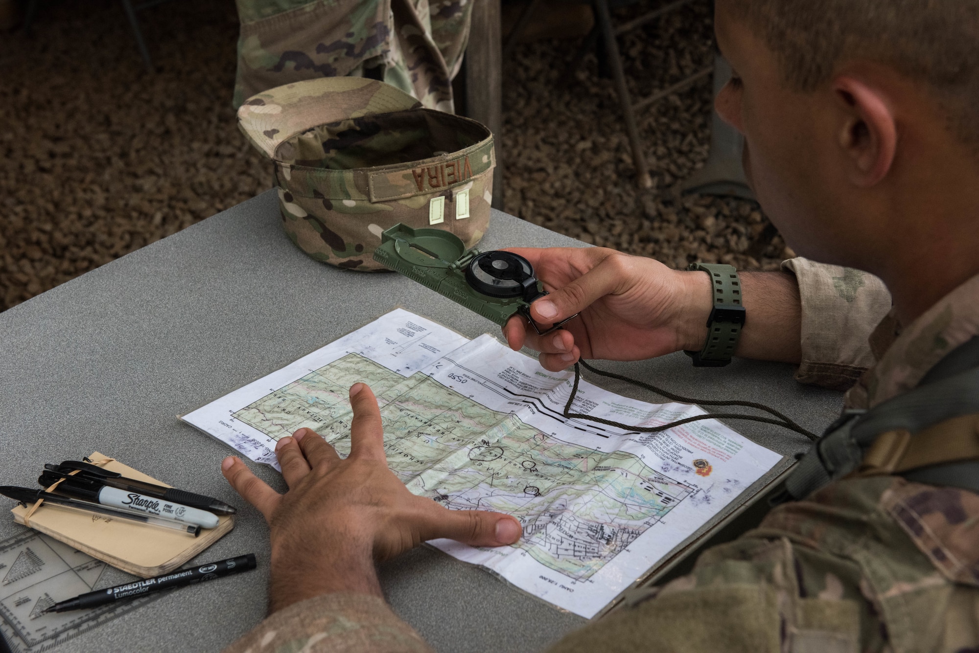 Tech. Sgt. Gabriell Vieira, Ranger Assessment Course student, learns about land navigation during training near Schofield Barracks, Oahu, Hawaii, May 13, 2019. Twenty-three Airmen from across the Air Force recently converged on a training camp for a three-week Ranger Assessment Course near Schofield Barracks, May 12-31, 2019. The purpose of the 19-day course is to prepare, assess and evaluate Air Force candidates for Army Ranger School. (U.S. Air Force photo by Staff Sgt. Hailey Haux)