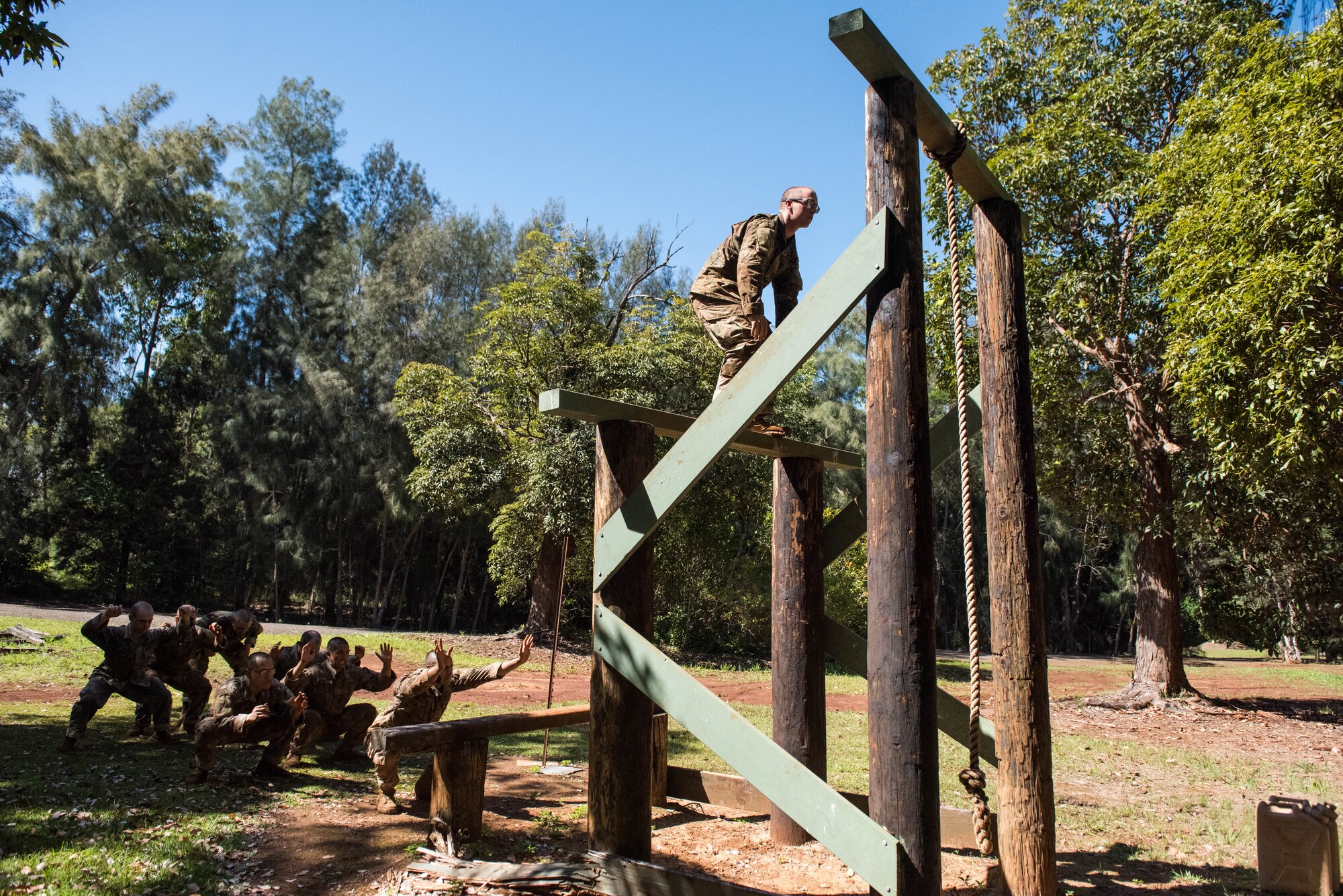 1st Lt. Austin Drake, Ranger Assessment Course student, prepares to jump to the next rung on an obstacle course during training near Schofield Barracks, Oahu, Hawaii, May 20, 2019. The purpose of the 19-day course is to prepare, assess and evaluate Air Force candidates for Army Ranger School. Of the 23 Airmen who began the Ranger Assessment Course, three dropped for personal motivational reasons and one dropped for medical reasons, leaving 19 standing at the end. Out of the 19, 11 Airmen met all the standards needed for a recommendation to go forward to Ranger School. (U.S. Air Force photo by Staff Sgt. Hailey Haux)