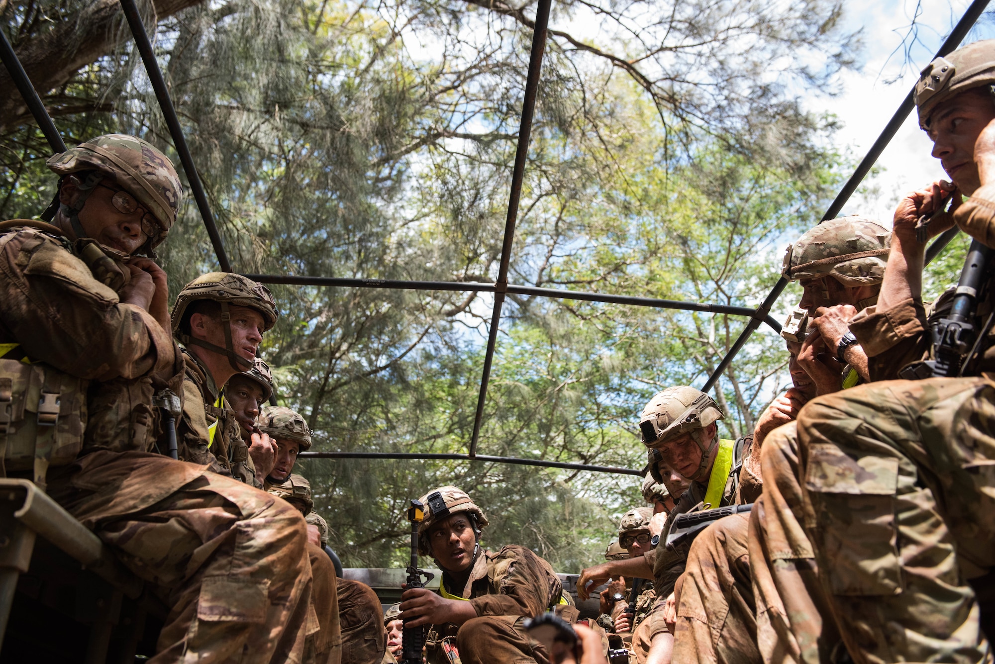 Ranger Assessment Course students prepare to ride back to camp after going through the obstacle course near Schofield Barracks, Oahu, Hawaii, May 20, 2019. Twenty-three Airmen from across the Air Force recently converged on a training camp for a three-week Ranger Assessment Course near Schofield Barracks, May 12-31, 2019. The purpose of the 19-day course is to prepare, assess and evaluate Air Force candidates for Army Ranger School. (U.S. Air Force photo by Staff Sgt. Hailey Haux)