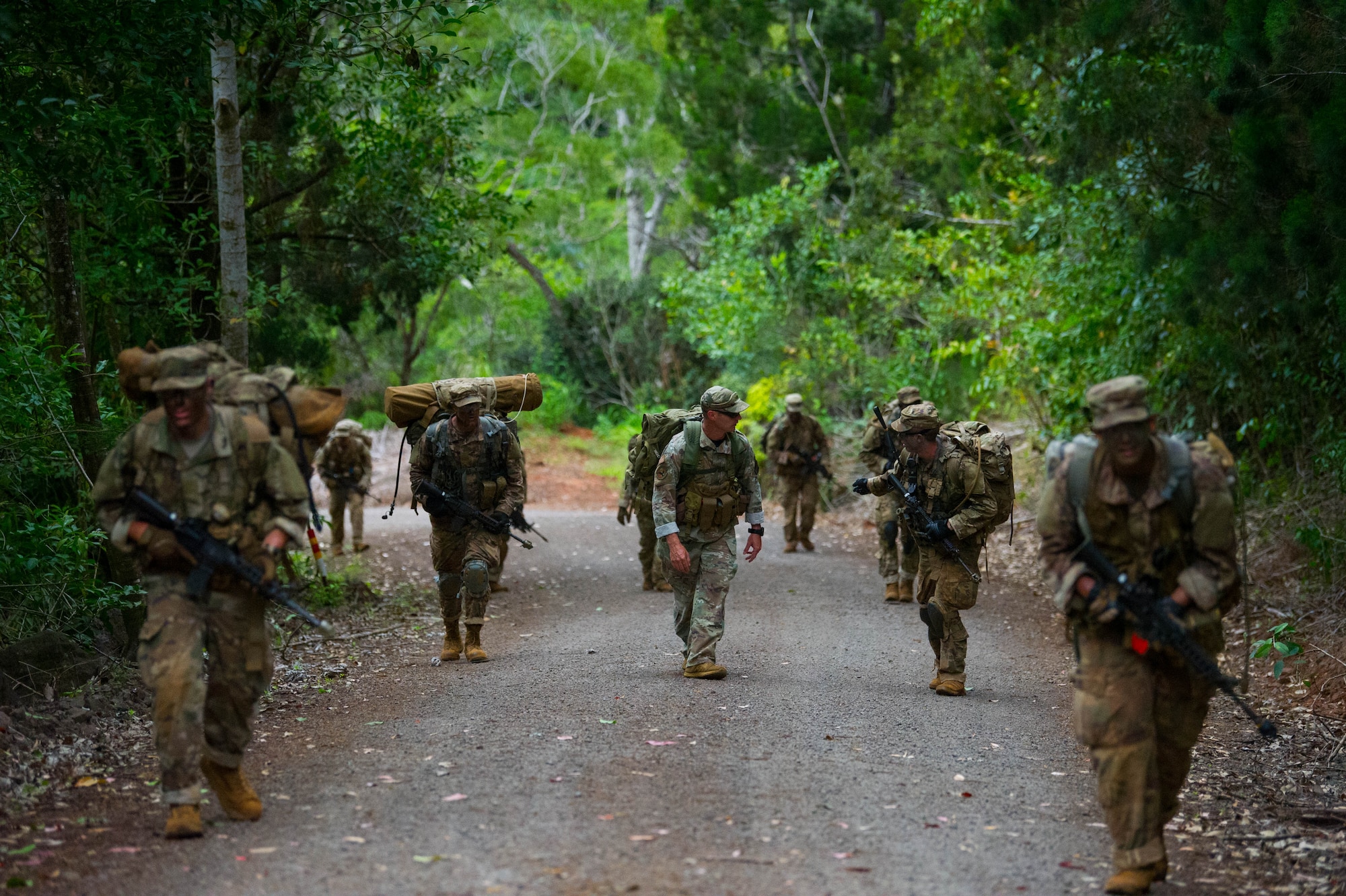 Ranger Assessment Course students ruck march along the road during training near Schofield Barracks, Oahu, Hawaii, May 23, 2019. Twenty-three Airmen from across the Air Force recently converged on a training camp for a three-week Ranger Assessment Course May 12-31, 2019. (U.S. Air Force photo by Staff Sgt. Hailey Haux)