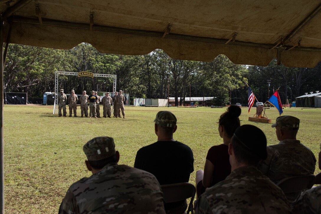 Friends, family members and co-workers watch as the newest students graduate from the Ranger Assessment Course near Schofield Barracks, Oahu, Hawaii, May 31, 2019. Throughout the 19-day course, Airmen were tested on their ability to perform land navigation, ambush, react to contact and squad attacks. Along with those assessments, the students went on runs and marches of different distances – all leading up to a 12-mile ruck march two days before graduation. (U.S. Air Force photo by Staff Sgt. Hailey Haux)