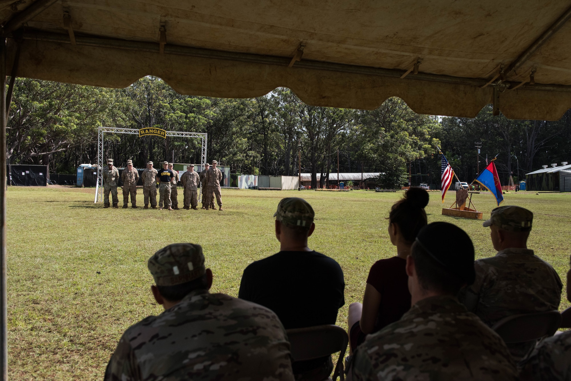 Friends, family members and co-workers watch as the newest students graduate from the Ranger Assessment Course near Schofield Barracks, Oahu, Hawaii, May 31, 2019. Throughout the 19-day course, Airmen were tested on their ability to perform land navigation, ambush, react to contact and squad attacks. Along with those assessments, the students went on runs and marches of different distances – all leading up to a 12-mile ruck march two days before graduation. (U.S. Air Force photo by Staff Sgt. Hailey Haux)