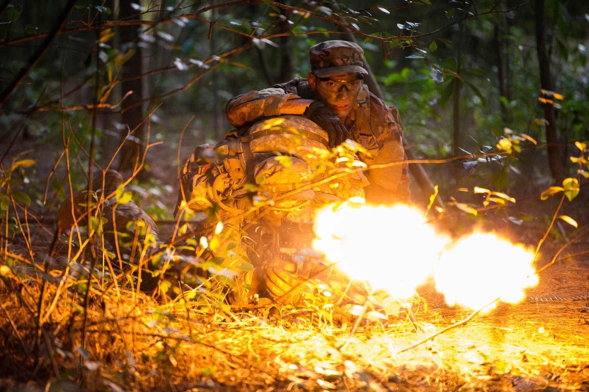 Staff Sgts. Jose Obregon and Joseph Pace, Ranger Assessment Course students, fire on opposing forces during a simulated react to contact near Schofield Barracks, Oahu, Hawaii, May 23, 2019. Twenty-three Airmen from across the Air Force recently converged on a training camp for a three-week Ranger Assessment Course May 12-31, 2019. The Airmen who pass the Ranger Assessment Course gain more than a ticket into Ranger School and knowledge on Army tactics – they learn to lead. (U.S. Air Force photo by Staff Sgt. Hailey Haux)