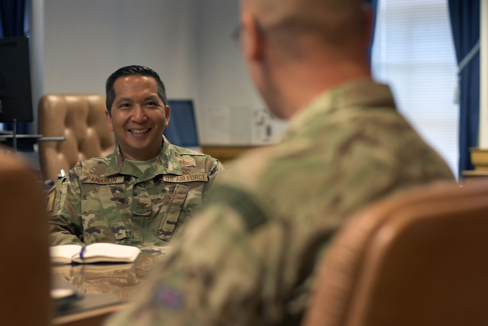 U.S. Air Force Col. Troy Pananon, 100th Air Refueling Wing commander, speaks with Squadron Leader Paul Graham, RAF Commander Mildenhall, at RAF Mildenhall, England, July 9, 2019. Pananon and Graham meet occasionally to discuss the best way to continue to maintain the strong relationship between the U.S. Air Force and the RAF at Mildenhall. (U.S. Air Force photo by Senior Airman Benjamin Cooper)