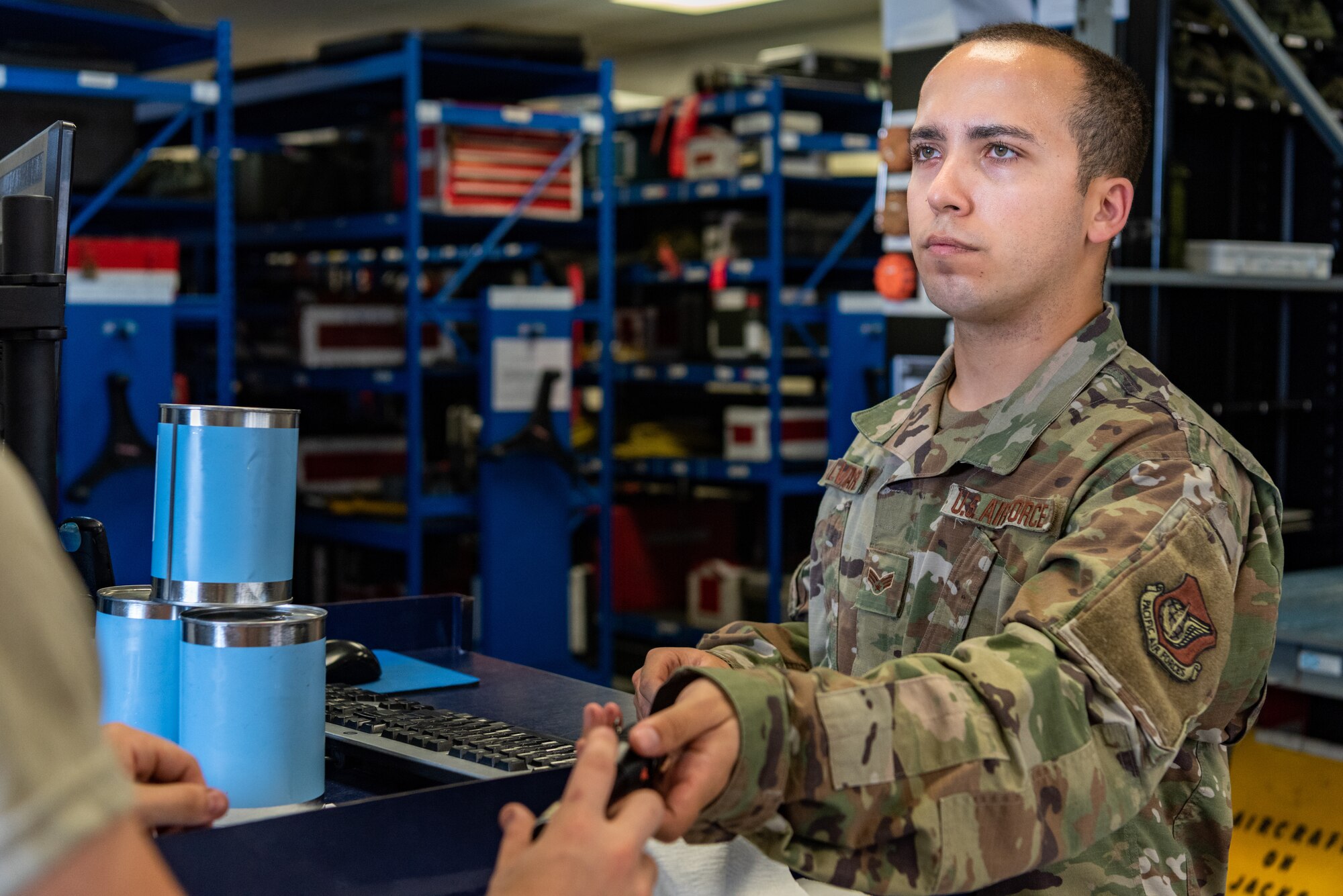 U.S. Air Force Senior Airman Adam Alvarez Martinez, F-15C Eagle support journeyman assigned to the 44th Aircraft Maintenance Unit, signs out tools during shift turnover June 27, 2019, on Kadena Air Base, Japan.