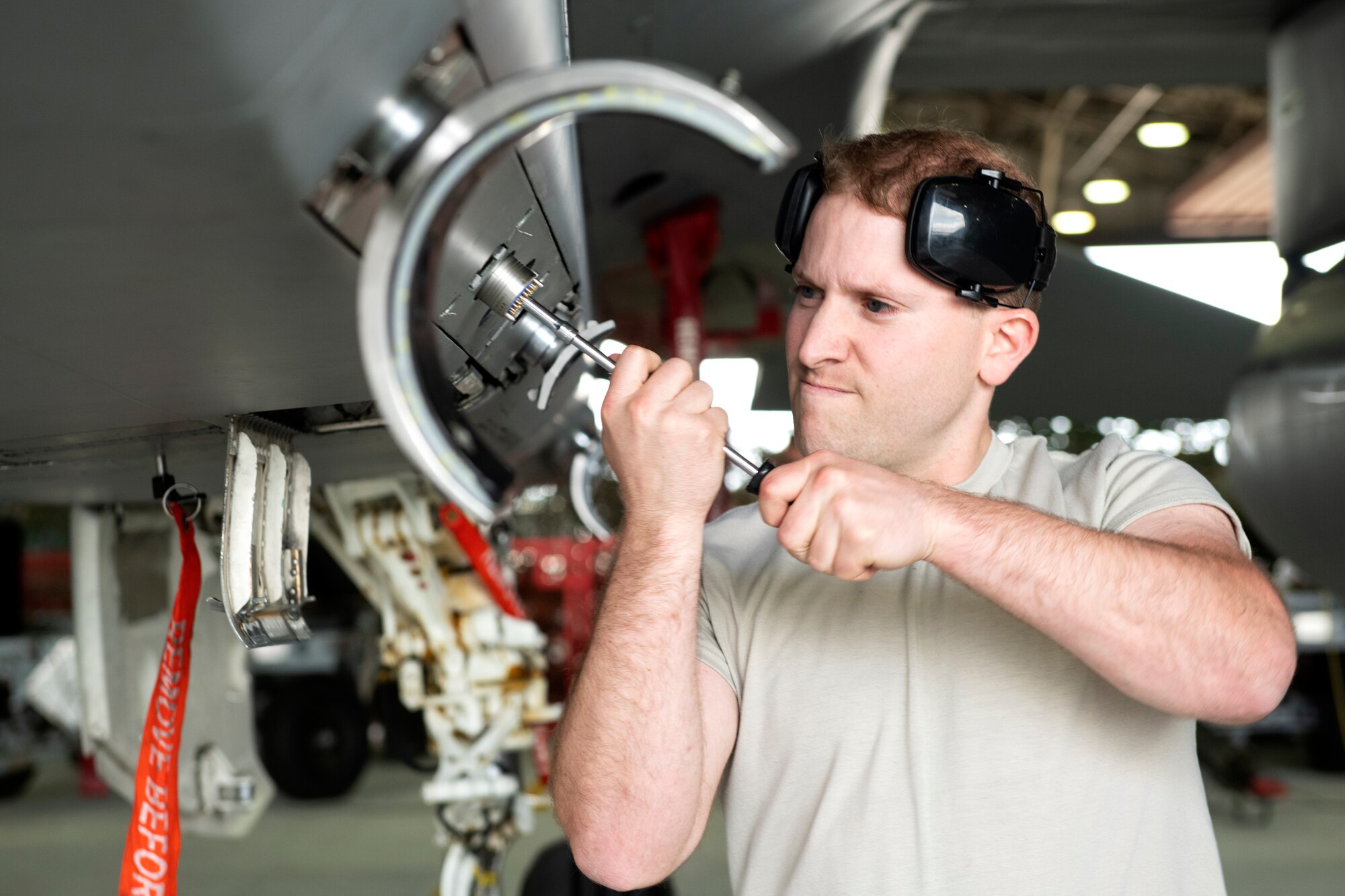 A 493rd Aircraft Maintenance Unit weapons load crew member prepares an F-15C Eagle to be loaded with ammunition during the 48th Fighter Wing 2019 second quarter Load Crew competition at Royal Air Force Lakenheath, England, July 3, 2019. The 48th Maintenance Group holds quarterly load crew competitions to give Airmen a chance to show off their technical prowess to peers and wing leadership. (U.S. Air Force photo by Senior Airman Malcolm Mayfield)