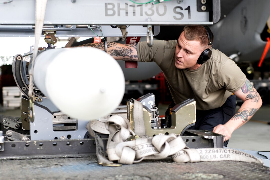 A 493rd Aircraft Maintenance Unit weapons load crew member prepares ordnance to be loaded onto an F-15C Eagle during the 48th Fighter Wing 2019 second quarter Load Crew competition at Royal Air Force Lakenheath, England, July 3, 2019. The 48th Maintenance Group holds quarterly load crew competitions to give Airmen a chance to show off their technical prowess to peers and wing leadership. (U.S. Air Force photo by Senior Airman Malcolm Mayfield)